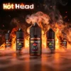 美國進口 Hot Head 暴脾氣尼古丁鹽煙油主圖。背景為燃燒的火焰與煙霧，襯托中央的草莓口味 (Strawberry) 30mL 瓶身。強調其 38mg 高濃度帶來的強勁擊喉感與全系列豐富口味。